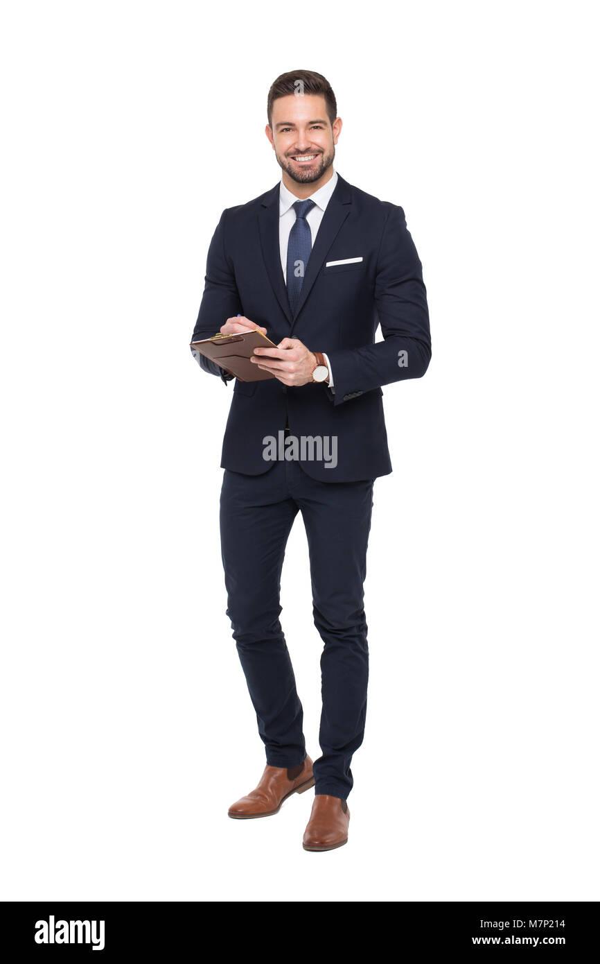 Young positive caucasian businessman holding clipboard, isolated on white, toothy smile Stock Photo