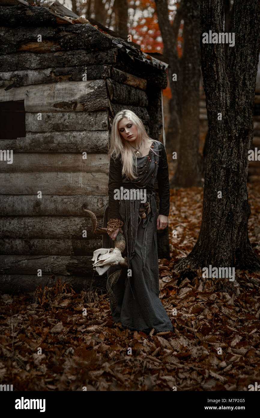 Witch in a long black dress Stock Photo