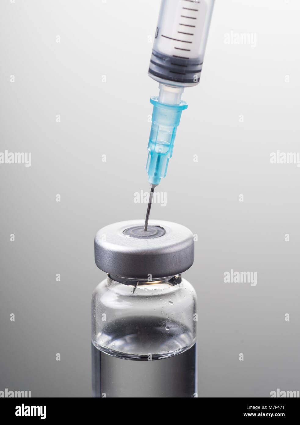 Medical syringe and vial with clear liquid isolated Stock Photo Alamy