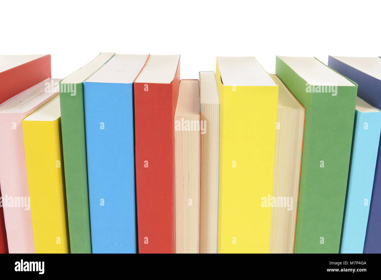 Row of colorful paperback books isolated on a white background Stock ...