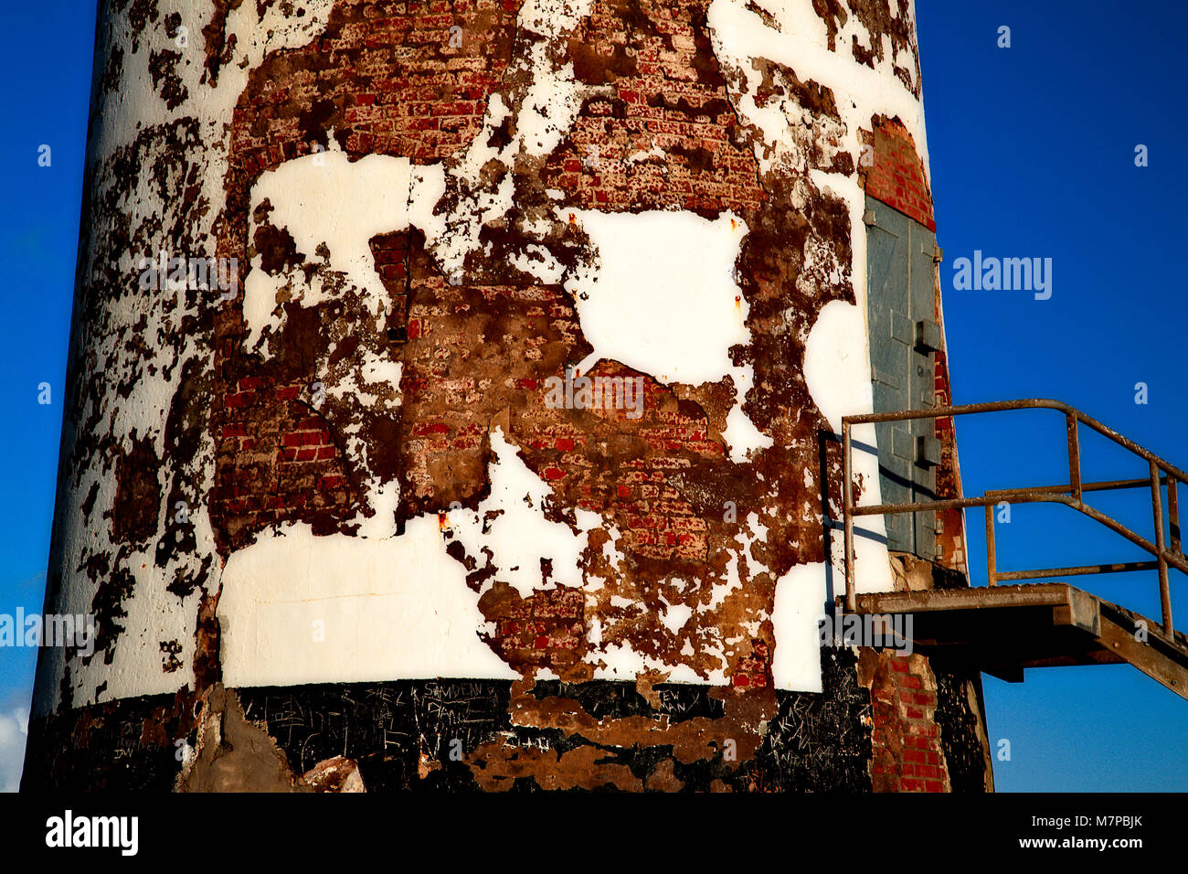 Derelict Point of Ayr lighthouse and steel steps on Talacre beach, North Wales coast Stock Photo