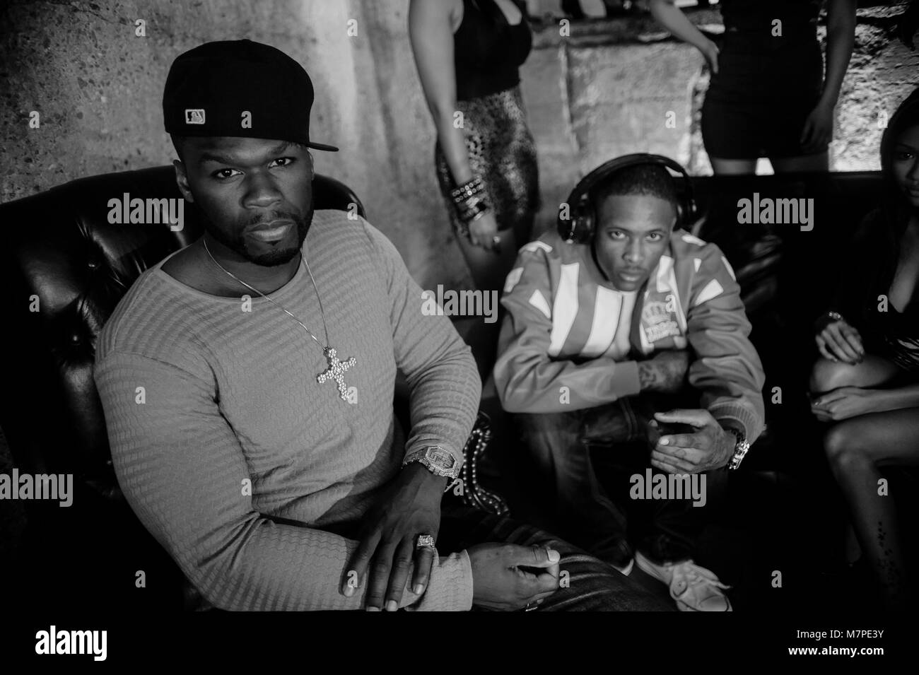 (L-R) 50 Cent & YG portrait on-set at the 'Toot It & Boot It Remix' Music Video on November 18, 2010 in Los Angeles. Stock Photo