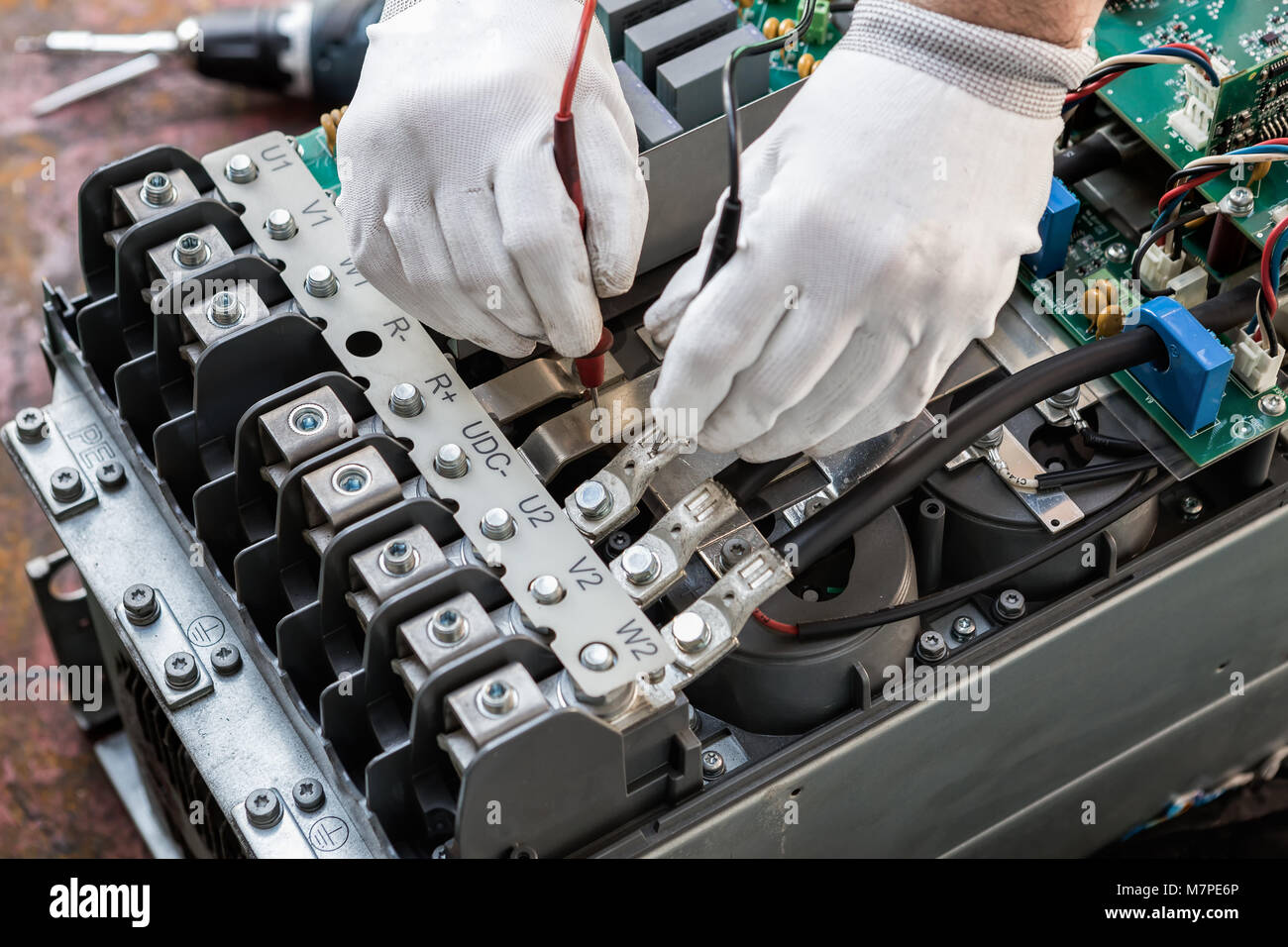 engineer working on checking and maintenance inverter and string ...
