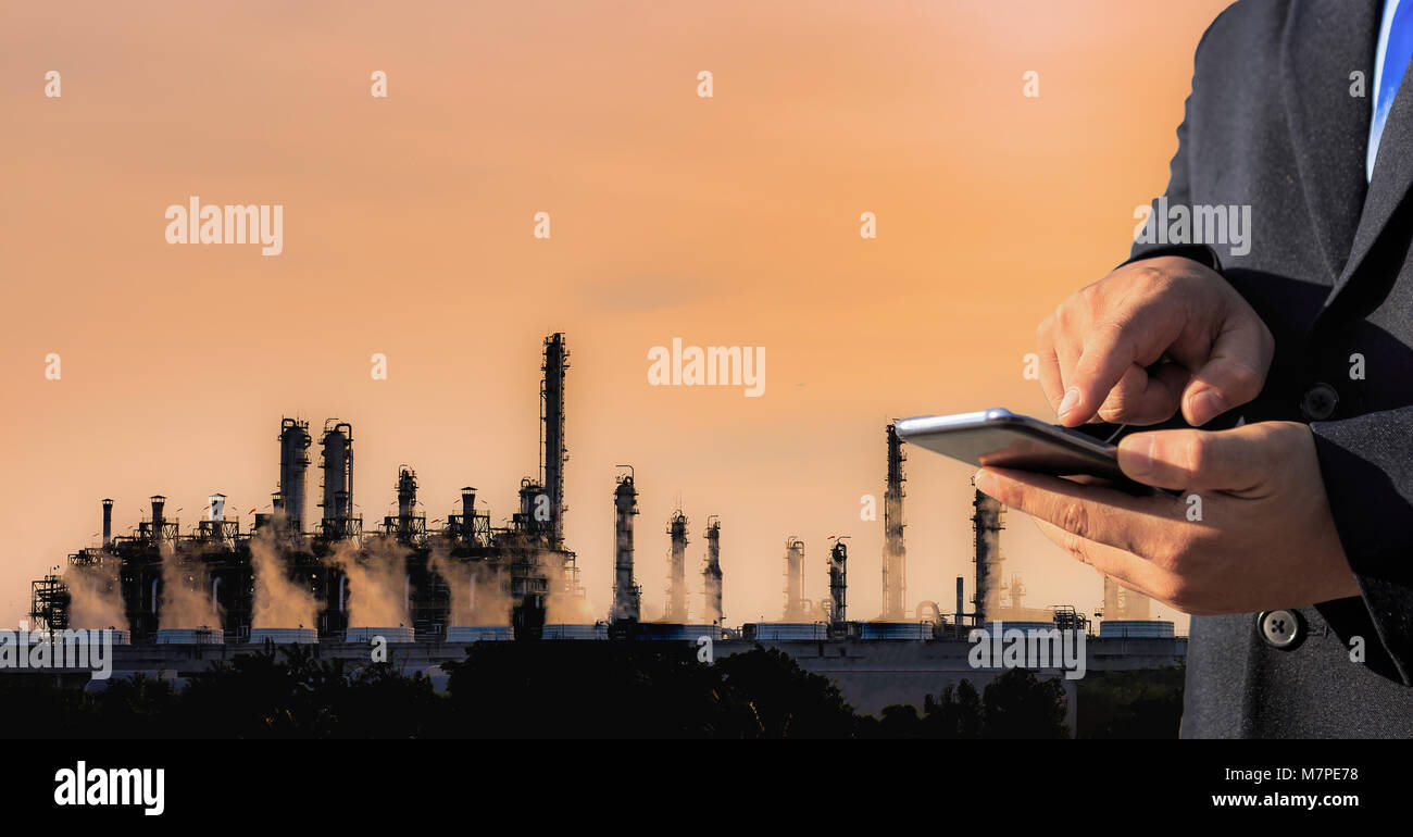 Businessman use smartphone check system in factory Stock Photo - Alamy