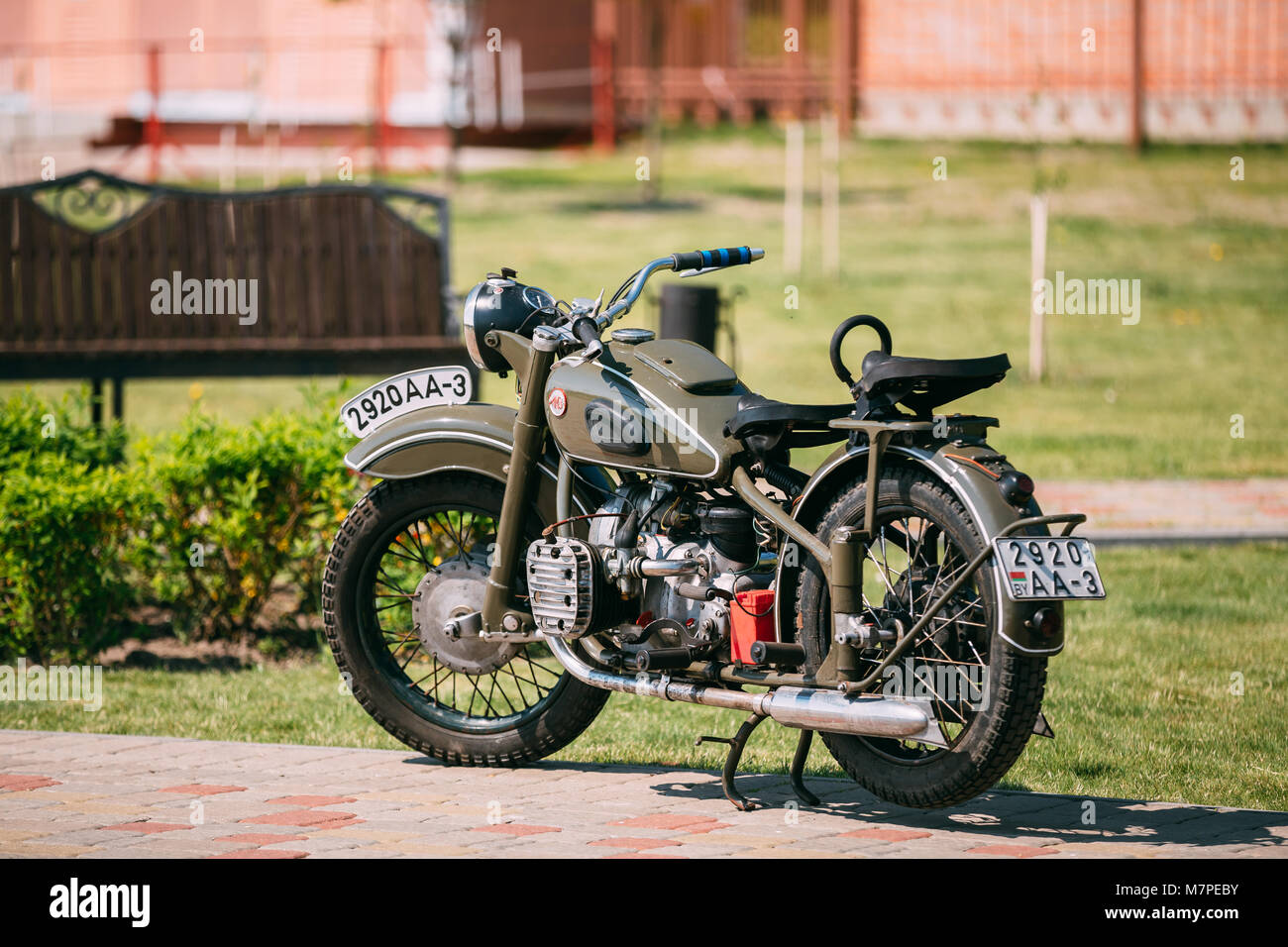 Gomel, Belarus - May 9, 2016: IMZ M-52 Ural, The Old Rarity Soviet Two-Wheeled Khaki Motorcycle, Standing On The Pavement In Sunny Summer Park. Stock Photo