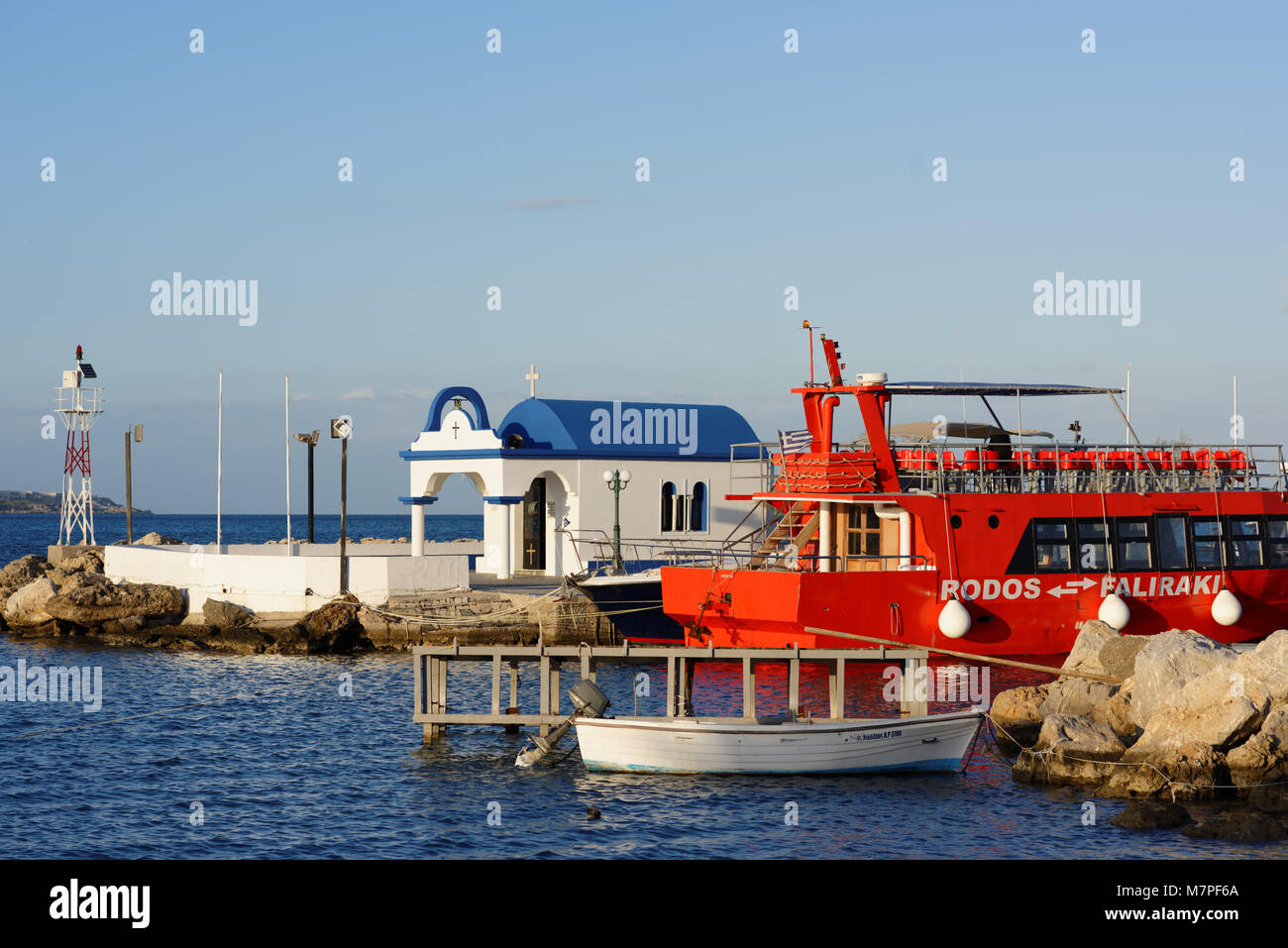 Faliraki, Rhodes island, Greece - October 8, 2017: Tour boat in the port of Faliraki. Faliraki is a popular tourist destination with a 5 km stretch of Stock Photo