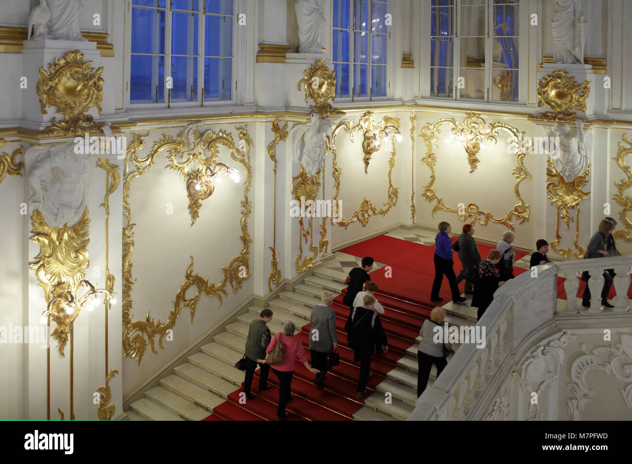 St. Petersburg, Russia - December 10, 2015: People admire the luxury interior of Winter Palace. Built in 1762 by design of Bartolomeo Francesco Rastre Stock Photo