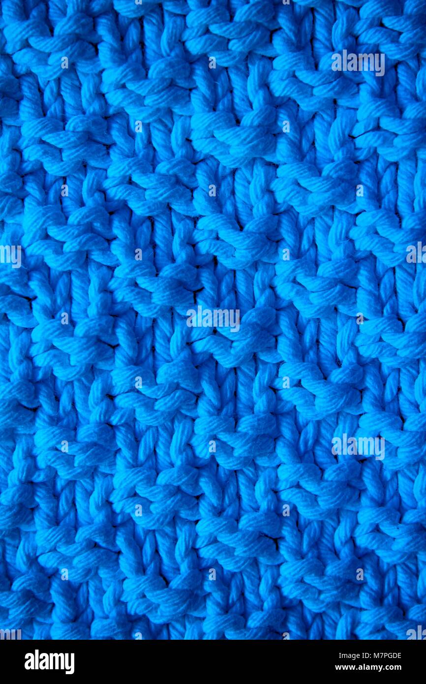 Blue texture of a knitted woolen fabric blue. Background for web site ...