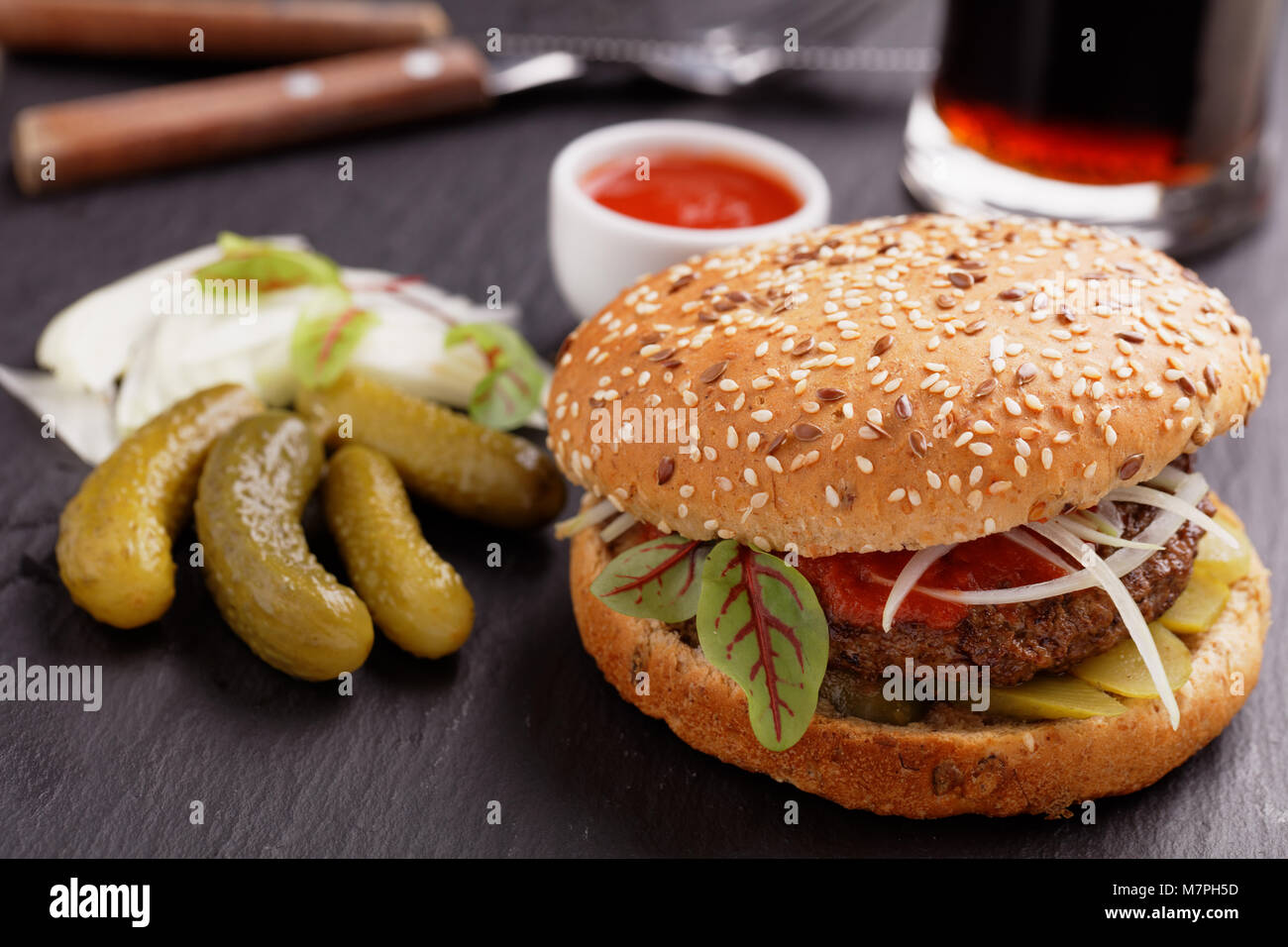 Homemade hamburger with pickles and chard closeup Stock Photo