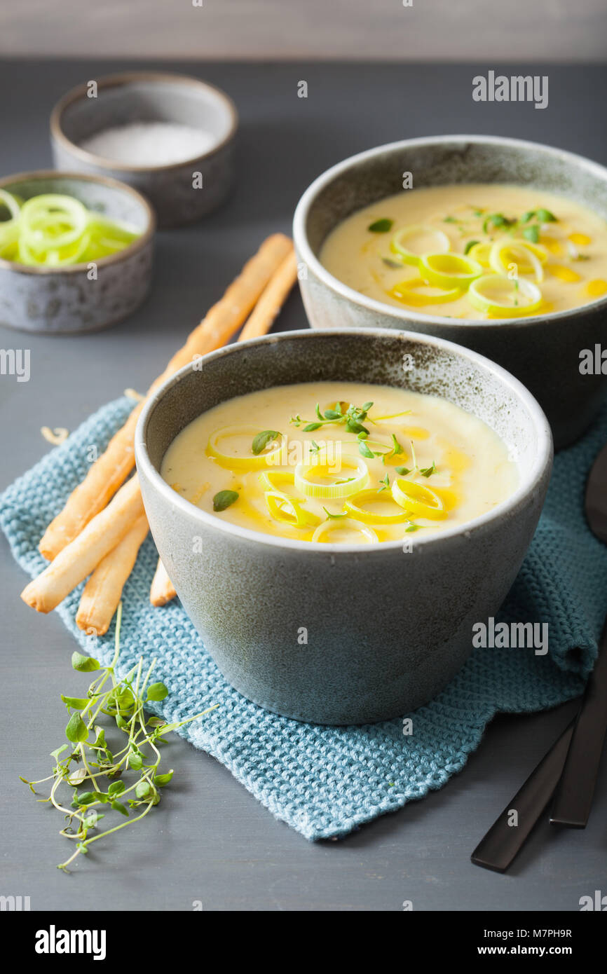 creamy potato and leek soup in bowl Stock Photo