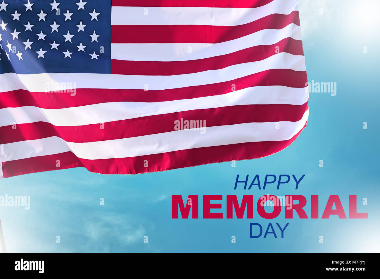 Happy memorial day with american flag waving over blue sky background ...