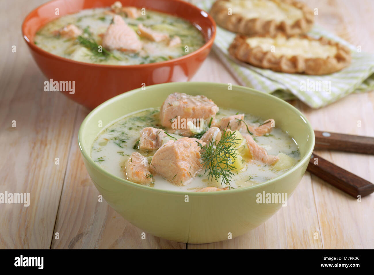 Finnish fish soup kalakeitto with salmon and cream on a rustic table Stock Photo
