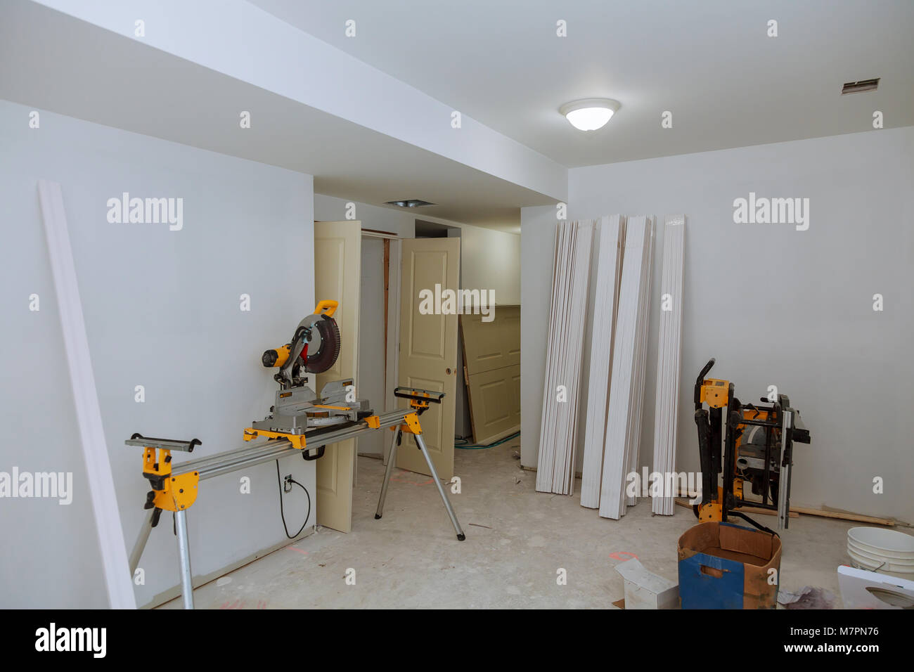cutting wood on electric saw Interior construction of housing Construction building industry new home construction interior drywall tape. Building con Stock Photo