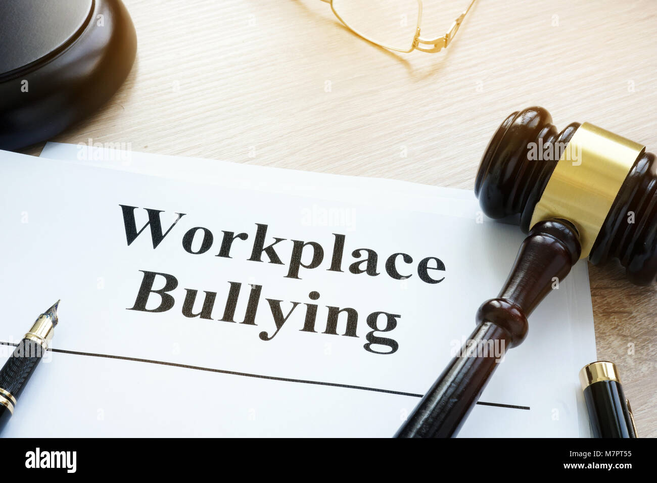 Documents about Workplace bullying in a court. Stock Photo