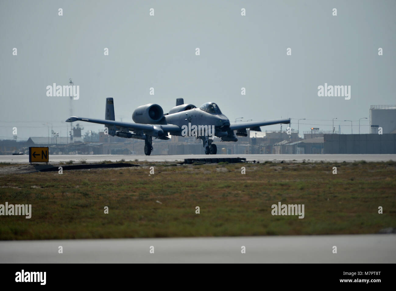 A U.S. Air Force A-10 Thunderbolt aircraft prepares to take off at Bagram Airfield, Afghanistan Oct. 24, 2014.  The A-10 is a specialized ground-attack aircraft which provides close air support to ground forces operating in Afghanistan. (U.S. Air Force photo by Staff Sgt. Evelyn Chavez) 455th Air Expeditionary Wing Bagram Airfield, Afghanistan Stock Photo
