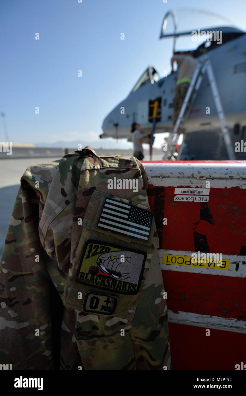 U.S. Air Force Senior Airmen with the 455th work on an A-10 Thunderbolt aircraft at Bagram Airfield, Afghanistan Oct. 24, 2014.  Aircraft maintainers are responsible for ensuring the A-10 is mission ready and able to perform close air support mission throughout Afghanistan in support of Operation Enduring Freedom. (U.S. Air Force photo by Staff Sgt. Evelyn Chavez/Released) 455th Air Expeditionary Wing Bagram Airfield, Afghanistan Stock Photo