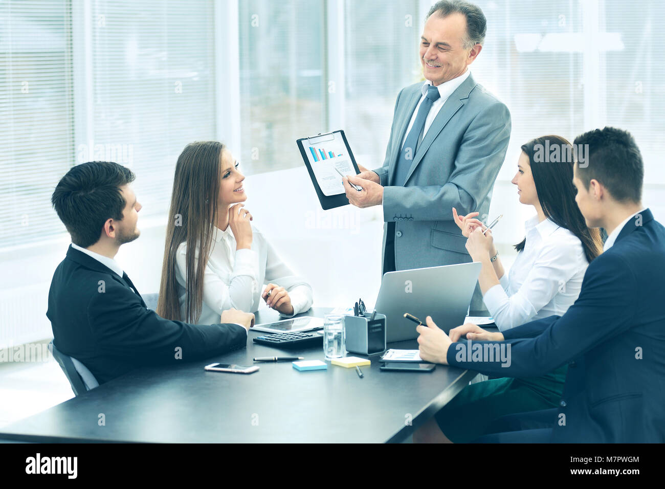 successful businessman and his business team meeting in a modern ...