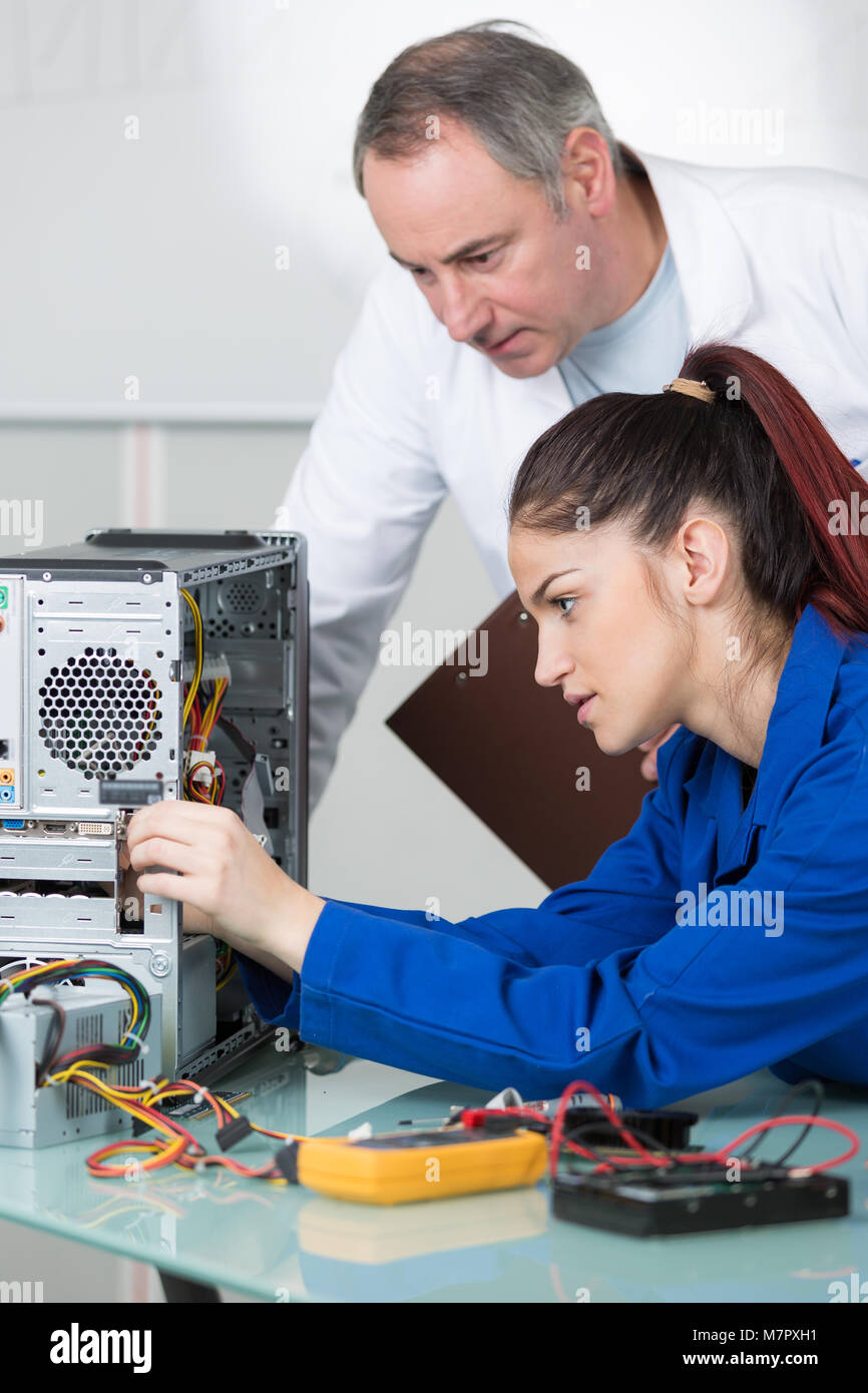 young female fixing a computer Stock Photo Alamy