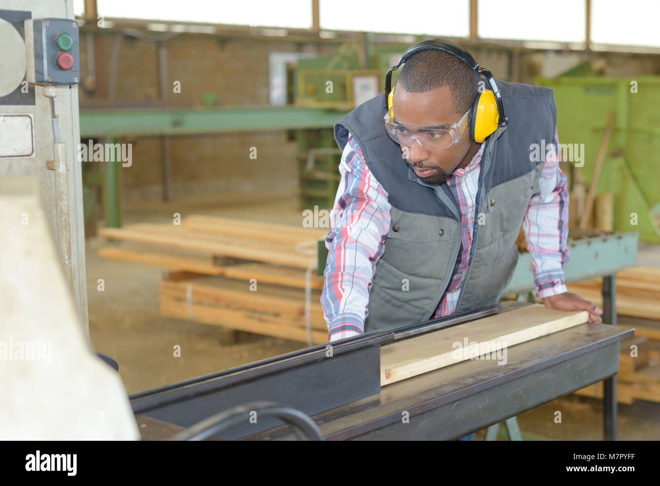Worker planing wood Stock Photo Alamy
