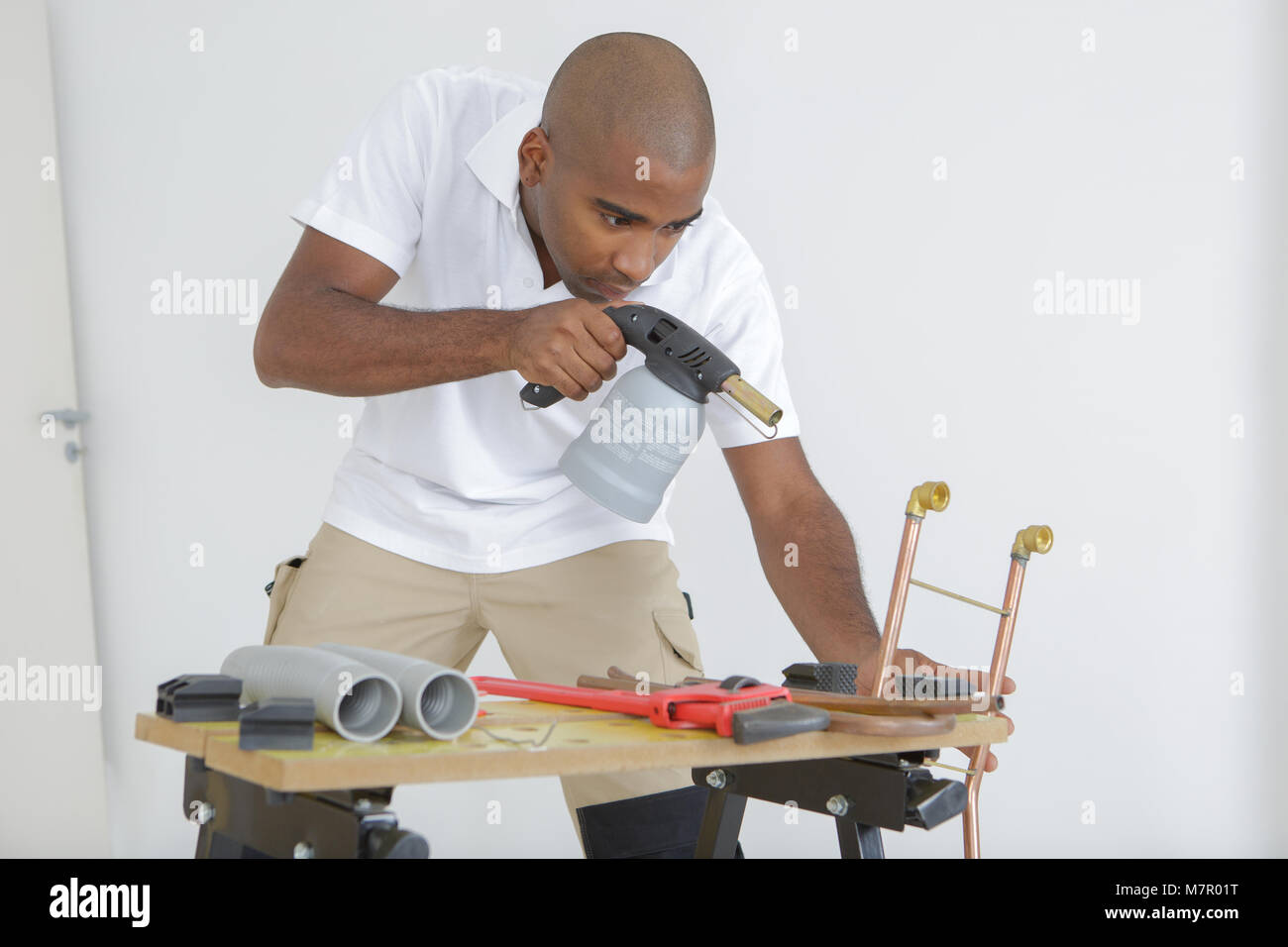 Man Using Blowtorch Man using blow torch Stock Photo - Alamy