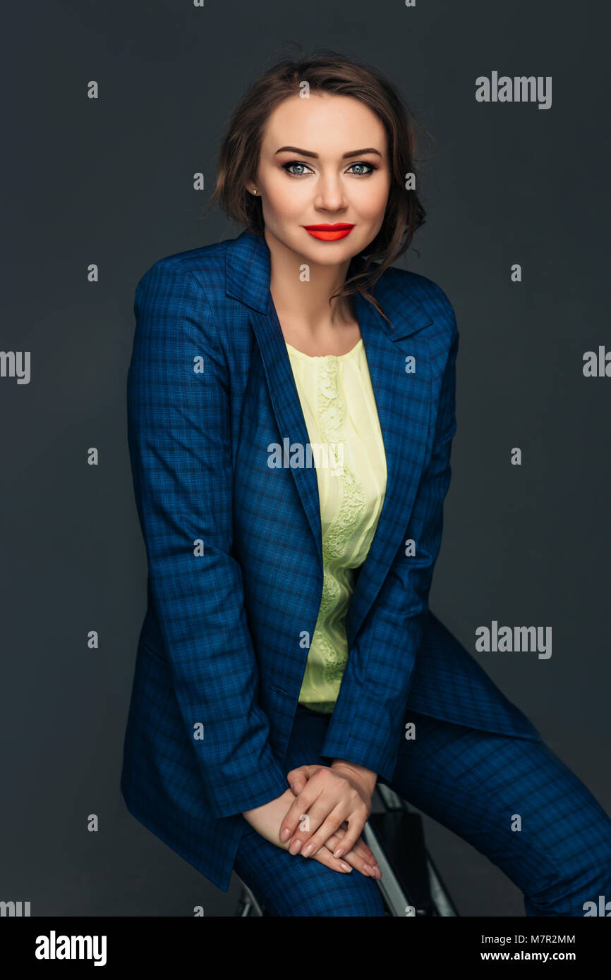 Portrait confident business woman on gray Stock Photo