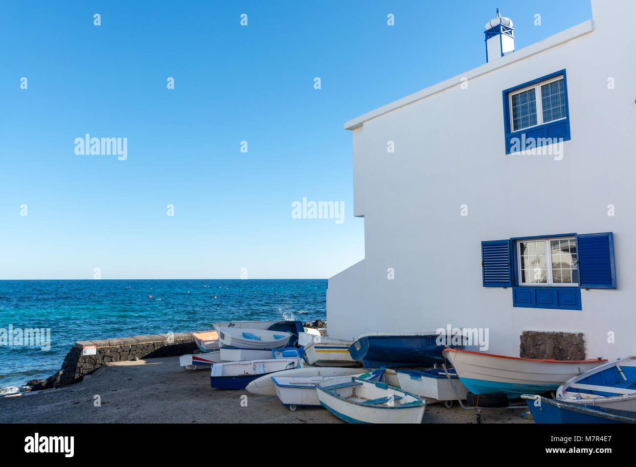 Sunset over the sea landscape with old blue wooden fishing boat Stock ...