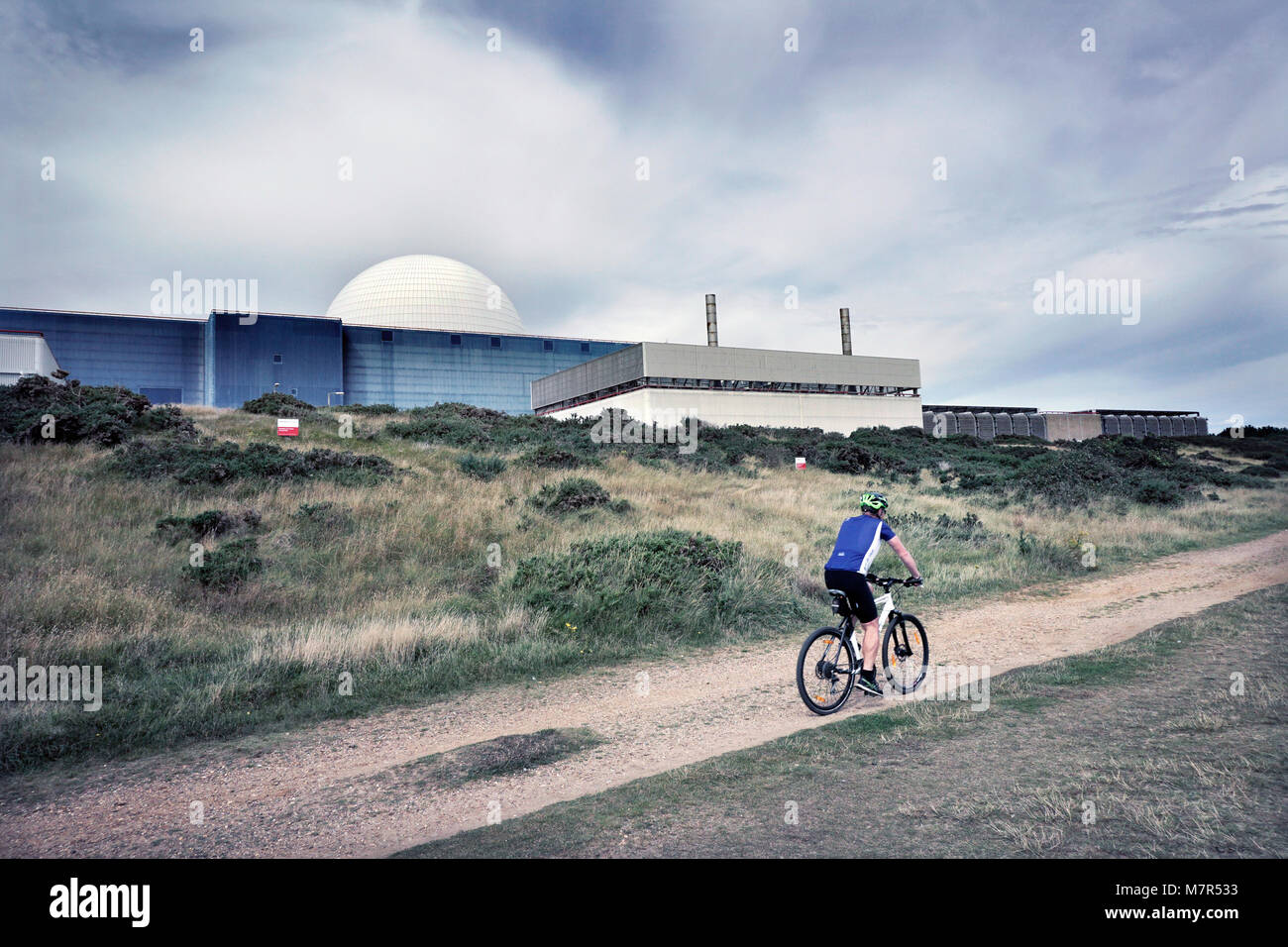 cycling past sizewell B nuclear power station sizewell suffolk england UK Stock Photo