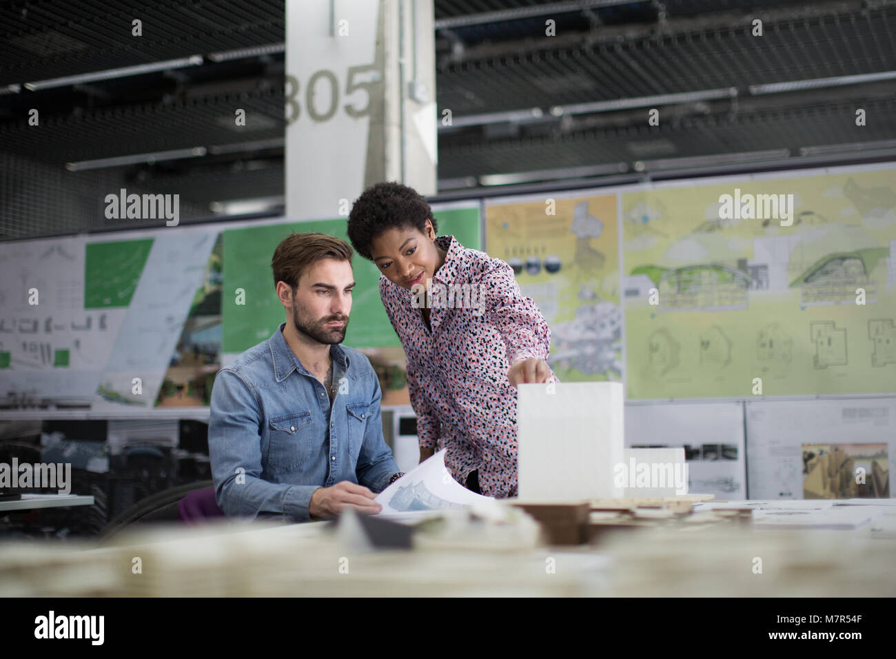 Architects discussing plans Stock Photo