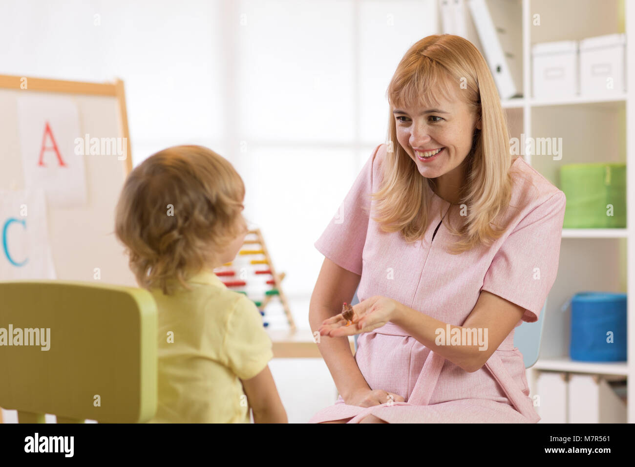 Child boy at lesson with psychologist. Preschool education. Stock Photo