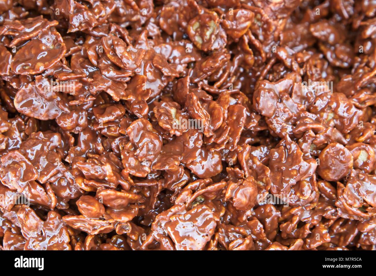 Corn flakes covered with melted chocolate Stock Photo Alamy