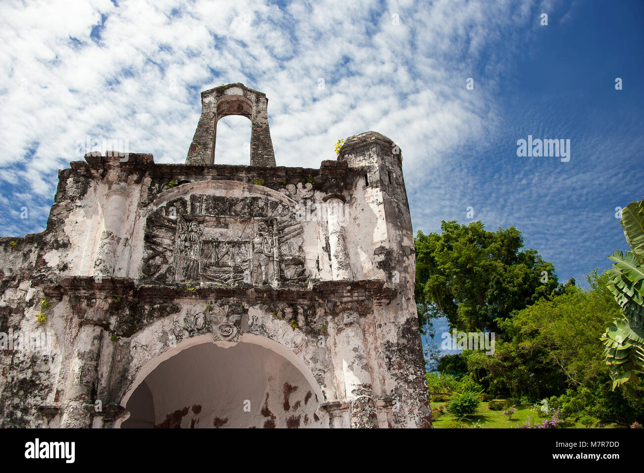 Close up Porta de Santiago, gate house, and only remaining part of A Famosa Portugese fortress in Malacca, Malaysia. Stone building, blue cloud sky Stock Photo