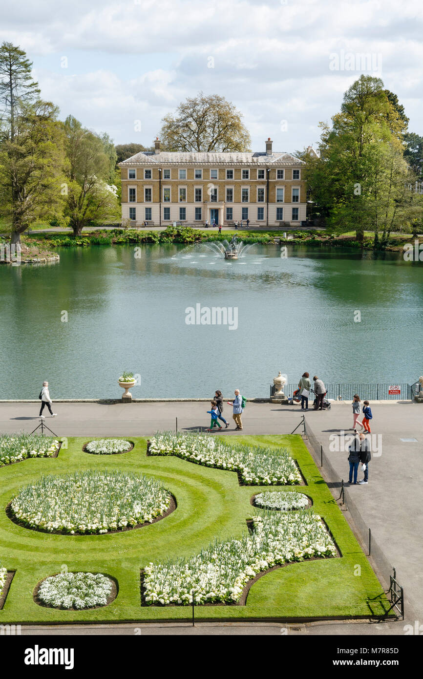 London, UK - April 18, 2014. Museum No 1 and lake in Kew Botanic Gardens. The gardens were founded in 1840 and are of international significance for b Stock Photo