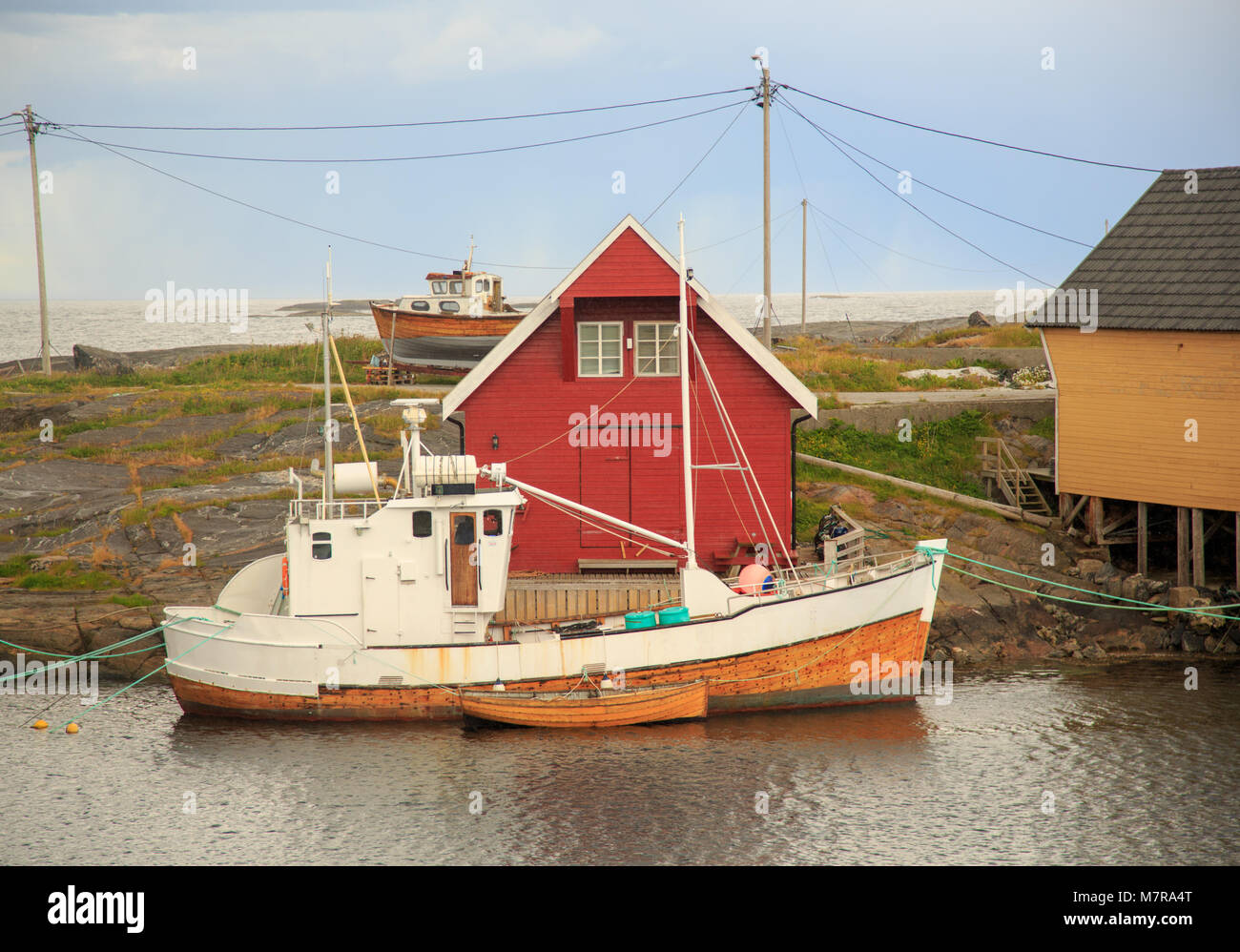 Fishing boat docked at pier on Ona Island - old fishing community in ...