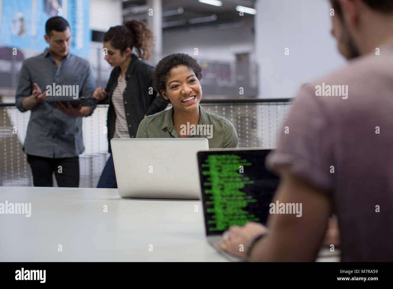 Coders working in an office Stock Photo