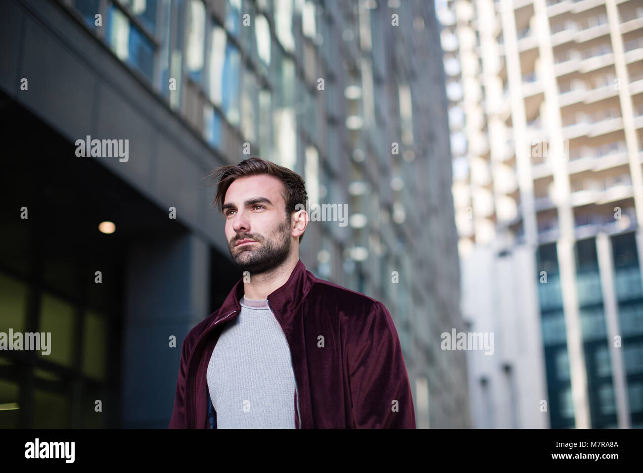 Young adult male walking in city Stock Photo