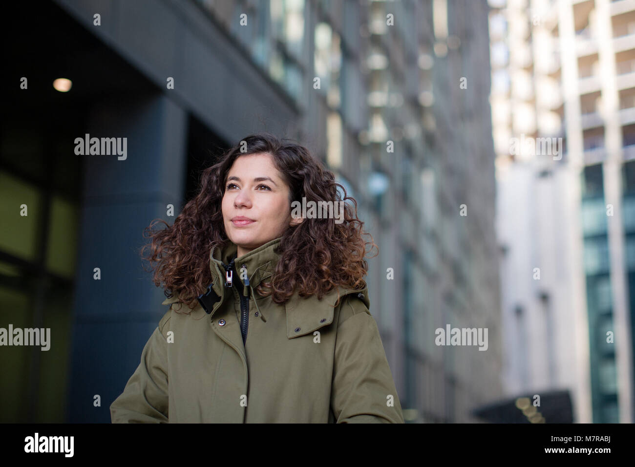 Young adult female walking in city Stock Photo