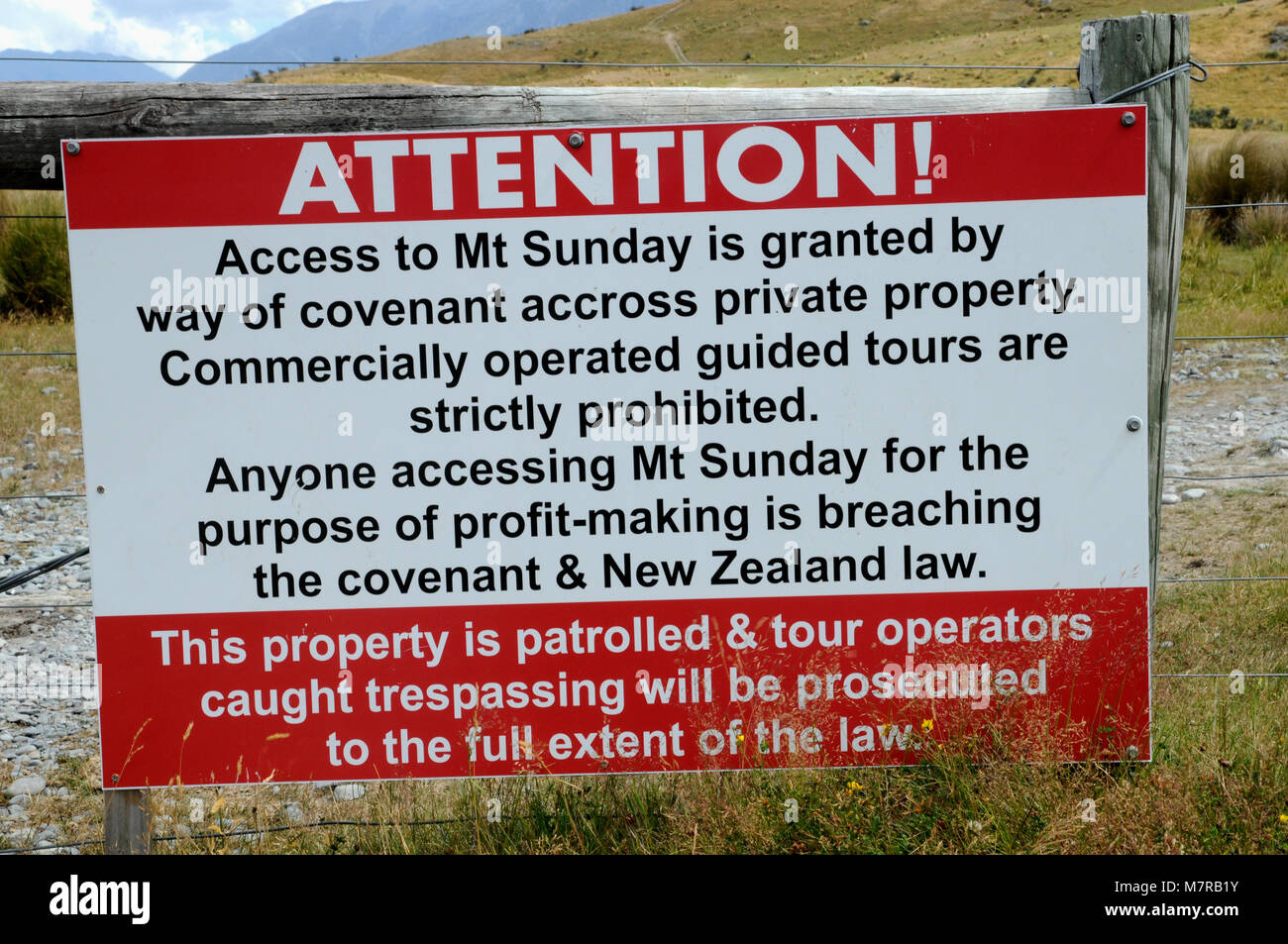 Notice at the start of the track up to Mount Sunday ( Edoras in Lord of the Rings). The idea is to stop this beautiful area being swamped by tourists. Stock Photo