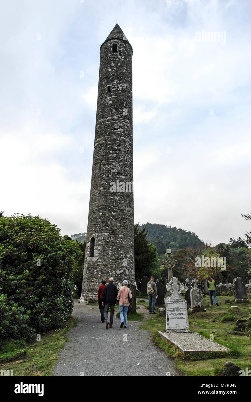 The 30 meters high Round Tower at Glendalough is in the valley of two lakes  in the Wicklow mountains national park in Southern Ireland. The early Chri  Stock Photo - Alamy