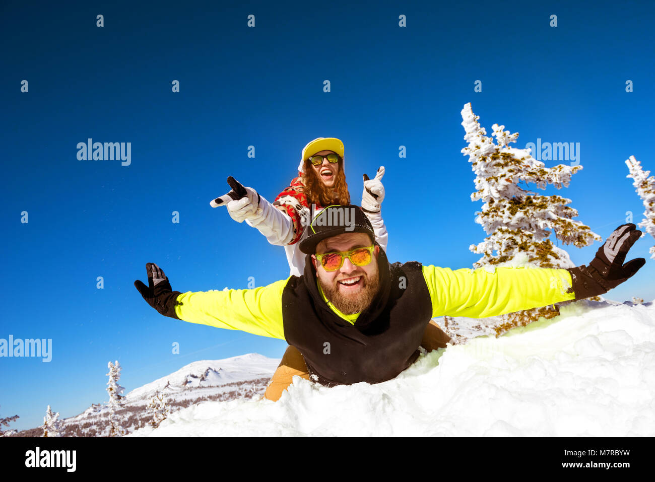 Happy couple having fun winter holiday Stock Photo