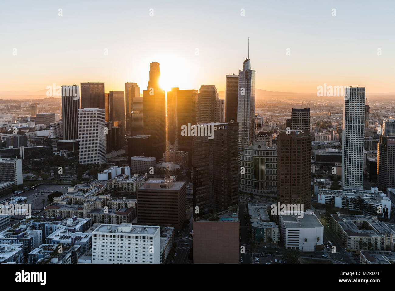Los Angeles, California, USA - February 20, 2018:  Aerial view of morning sunshine shining through highrise towers in downtown LA. Stock Photo