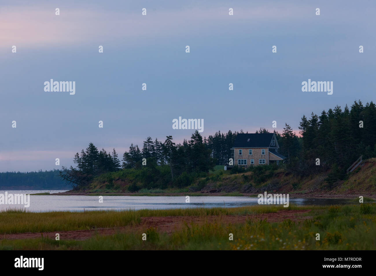 A private residence sits along the shoreline of Prince Edward Island on Canada's east coast. Stock Photo