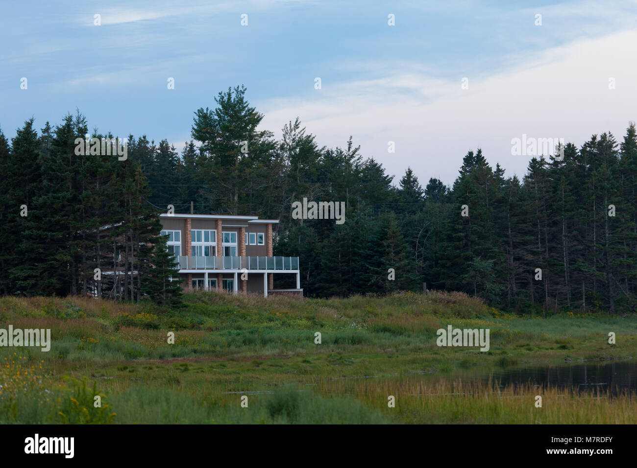 A private residence sits along the shoreline of Prince Edward Island on Canada's east coast. Stock Photo