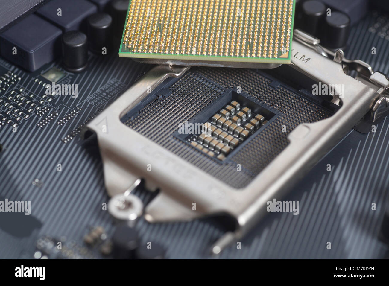 Intel LGA 1151 cpu socket on motherboard Computer PC with cpu processor close up Stock Photo