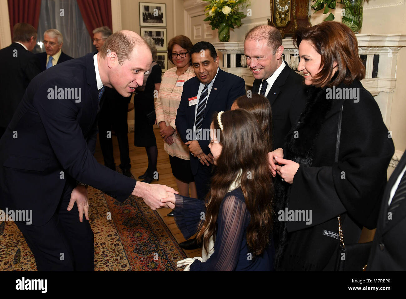 The Duke of Cambridge (left) meets meets meets the Prime Minister of Malta Joseph Muscat, his wife Michelle Muscat and their daughters at a reception held by the Commonwealth Secretary-General, Rt Hon Patricia Scotland QC, at Marlborough House, the home of the Commonwealth Secretariat in London. Stock Photo