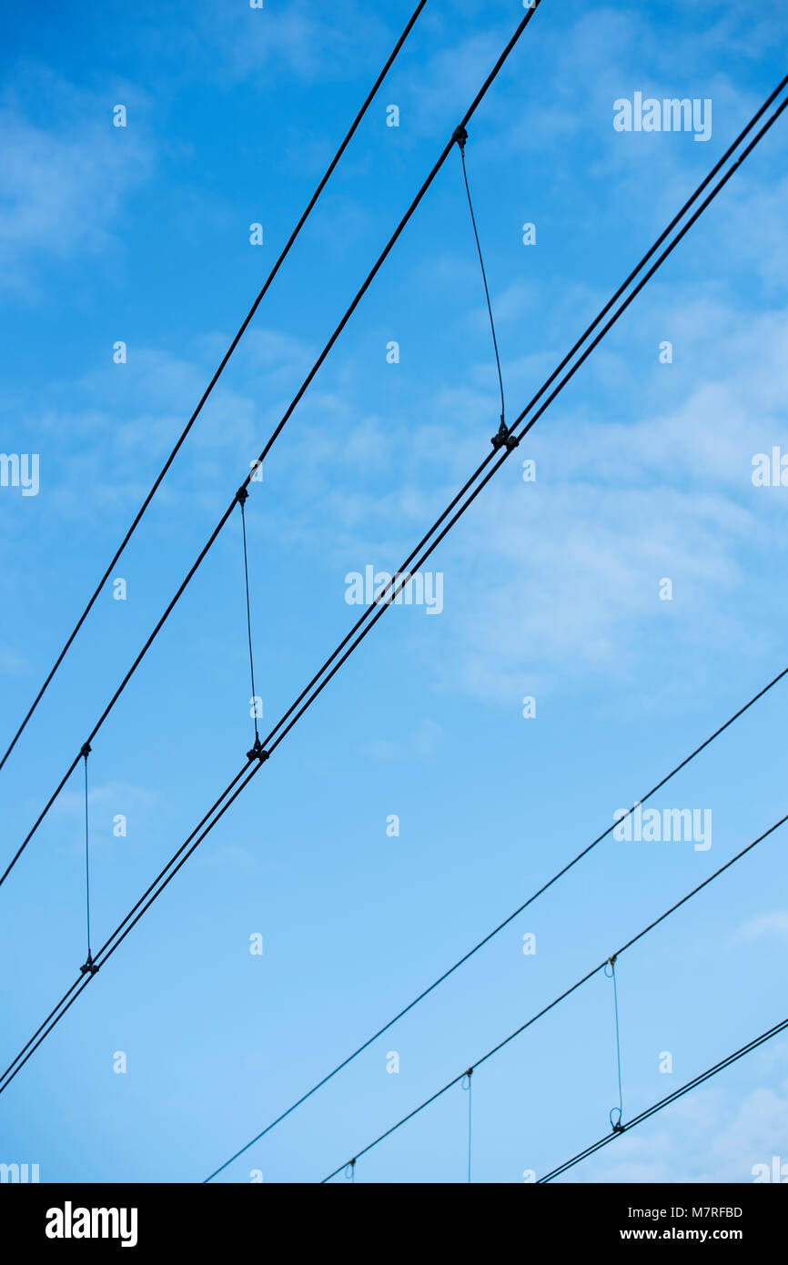 Power cables over a railway line Stock Photo Alamy