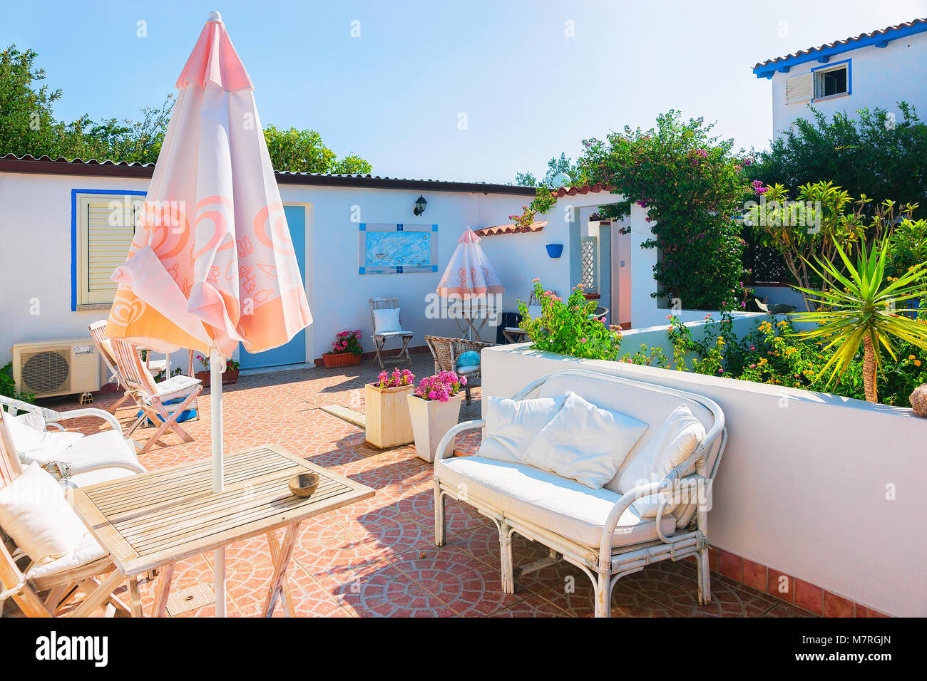 Italian courtyard with sofa hi-res stock photography and images - Alamy