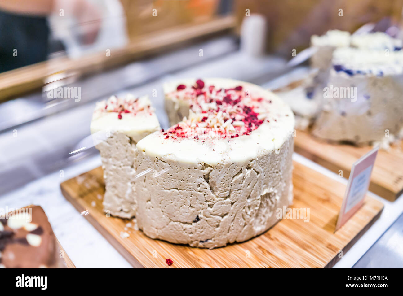 Macro closeup of large whole sweet sesame seed paste tahini halvah in