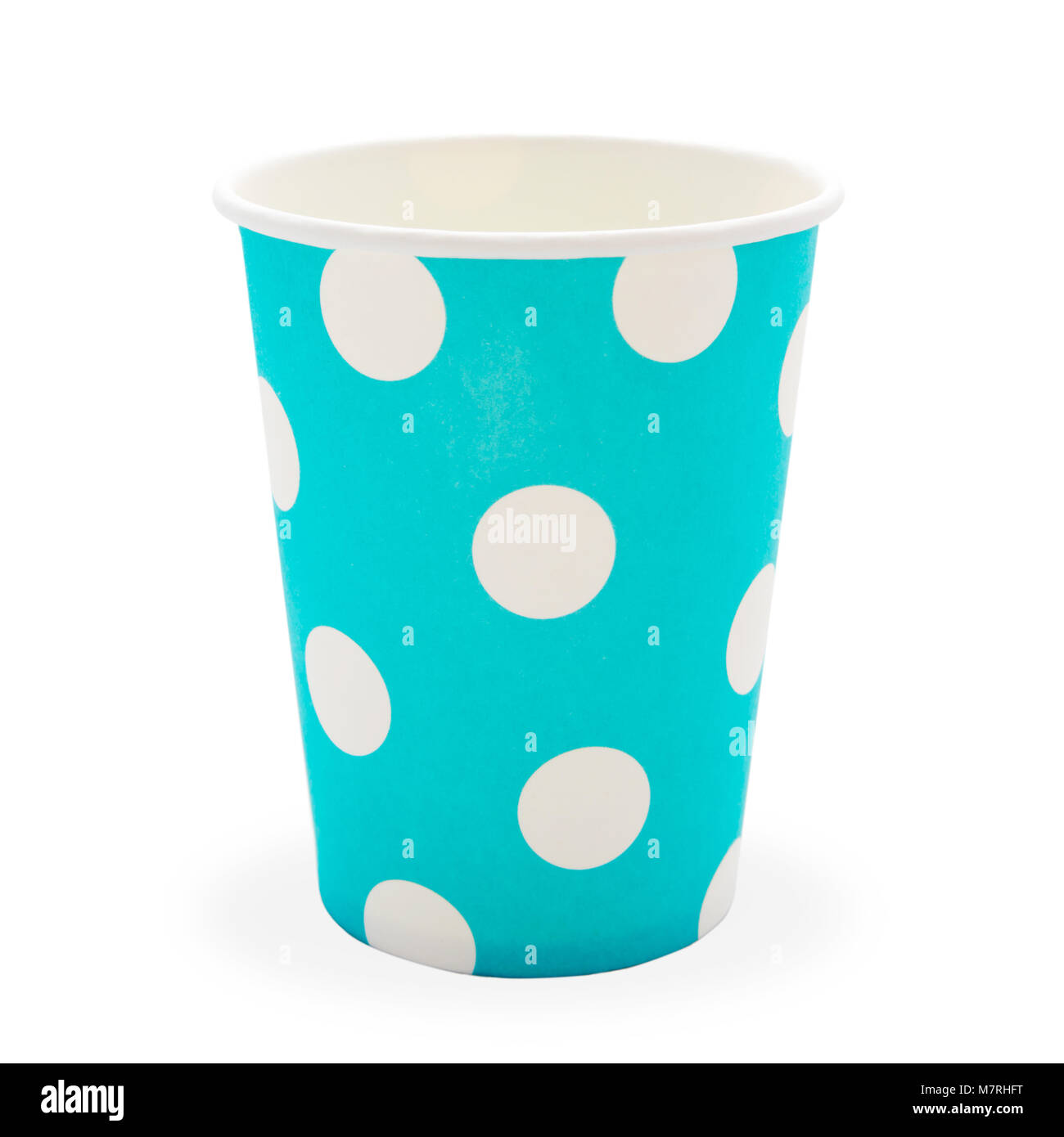blue paper disposable glass in polka dot isolated on white with copy