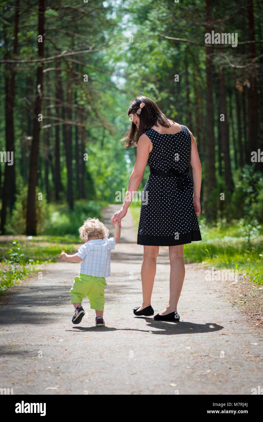 Baby learning to walk Stock Photo