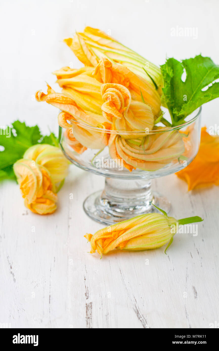 Edible zucchini flowers on white background Stock Photo Alamy